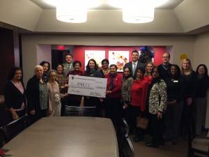 December 18, 2014 – Vasanta Mushunuri , President of the Asian Indian Women’s Organization (AIWO), and other members of AIWO presented a $55,000 check to Ronald McDonald House Charities of Central Illinois (RMHCCI) on Wednesday, December 17. The money was raised through their recent 9th India Night held on November 14, 2014.
